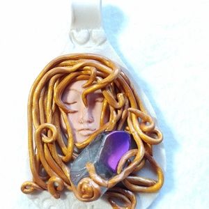 Aqua Aura lovingly wrapped in polymer clay